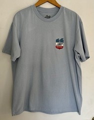 Lost Enterprises Men’s Short Sleeve Tshirt Light Blue W/ Red White And Blue Logo