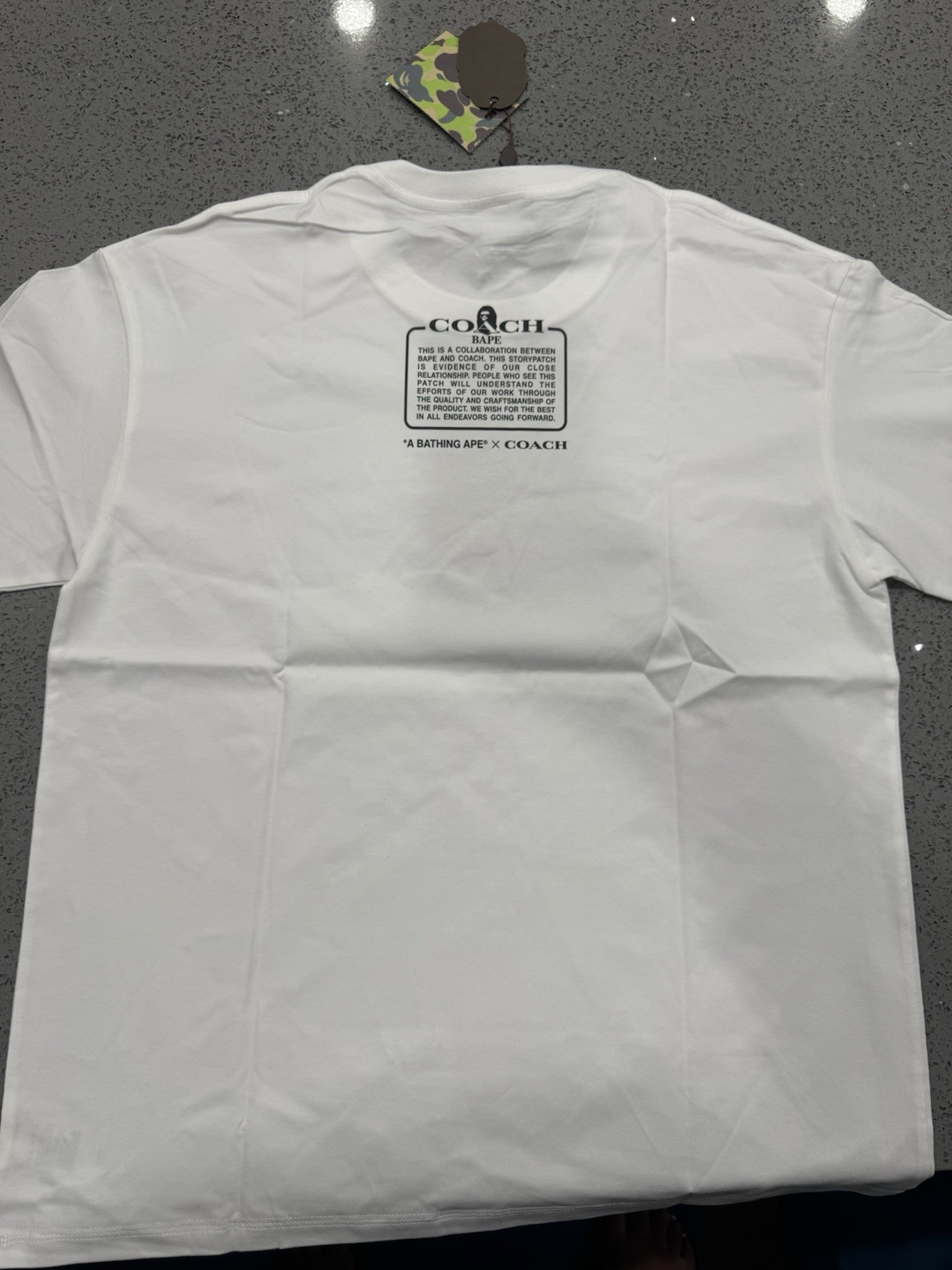 A Bathing Ape x Coach Men's White Graphic Print Crew Neck Short Sleeve Tee gallery