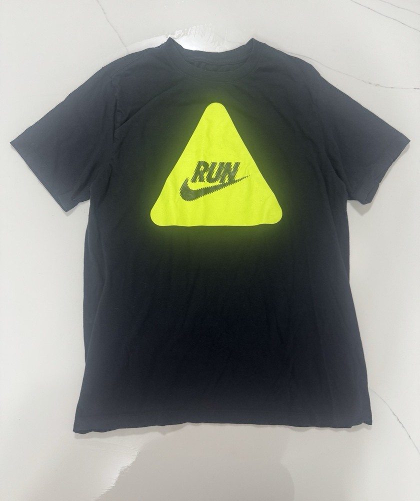 Nike “RUN” graphic t-shirt featuring a bold neon yellow triangle logo