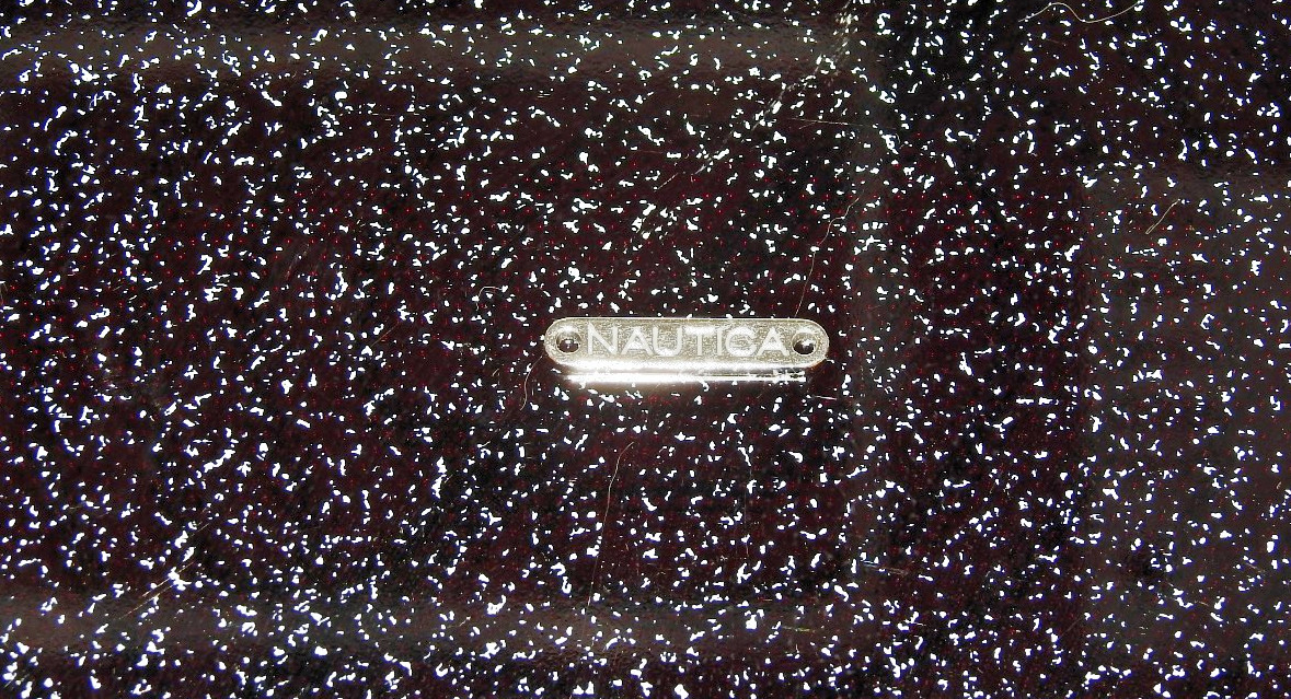 Nautica metal tag from apparel item – silver-tone. 1″ Long x 3/16″ Tall