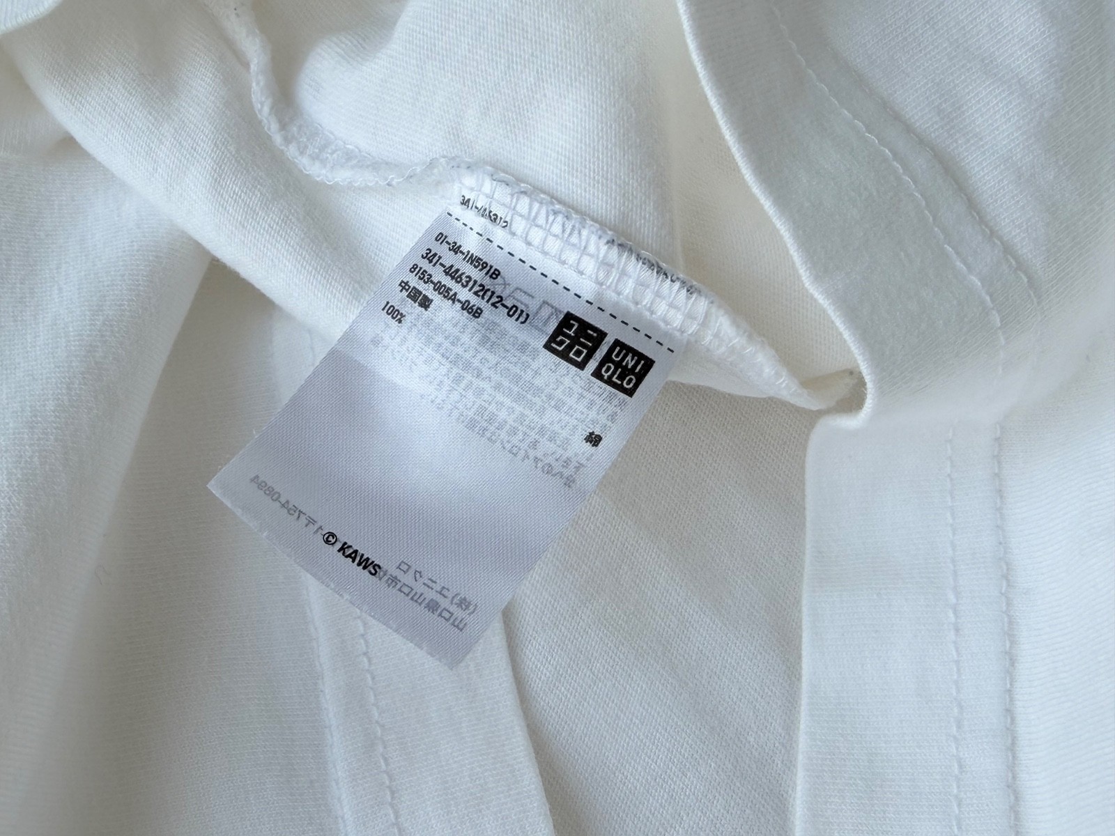 KAWS x UNIQLO T-Shirt Size XL White Used Stain on Back Japan gallery
